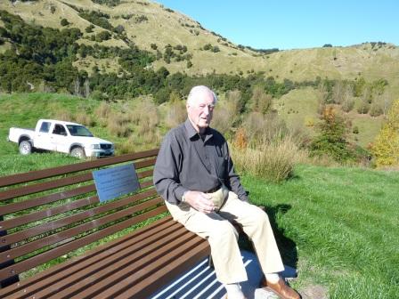 Mr Noel Sutherland at the Douglas Campbell Commemorative Bench at Lake Tutira; Commemorative bench.